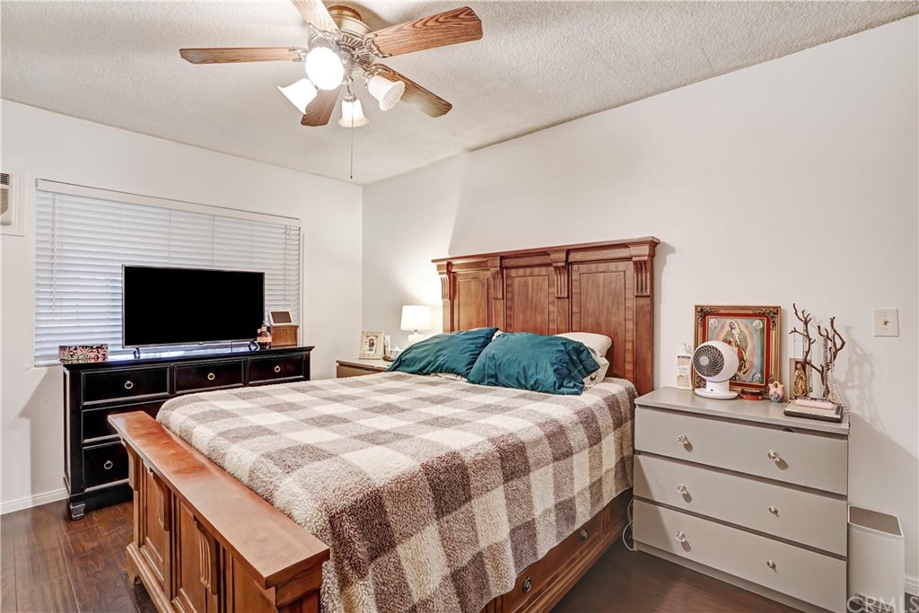 10223 25th Street Rancho Cucamonga, CA 91730 - Photo 14 of 17 a bedroom with a bed and a flat screen tv
