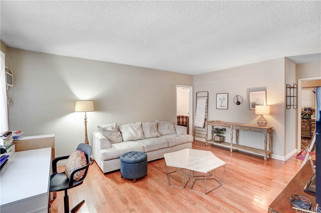 10223 25th Street Rancho Cucamonga, CA 91730 - Photo 3 of 17 a living room with furniture and a table