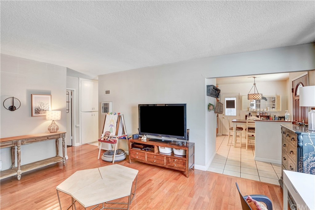 10223 25th Street Rancho Cucamonga, CA 91730 - Photo 4 of 17 a living room with furniture and a flat screen tv