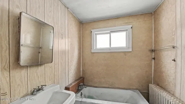 a bathroom with a sink and a shower