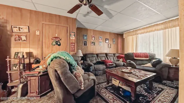 a living room with furniture and a rug