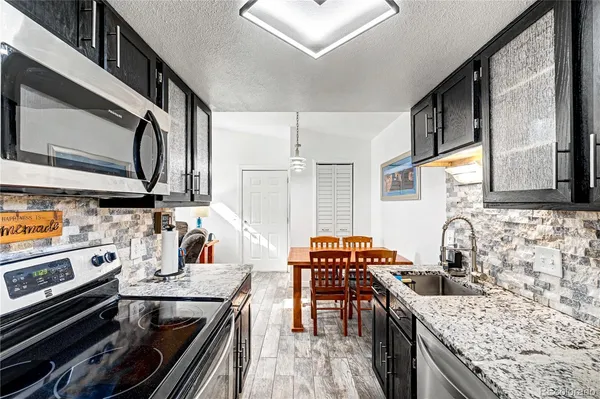 a bedroom with a bed and a lamp on table