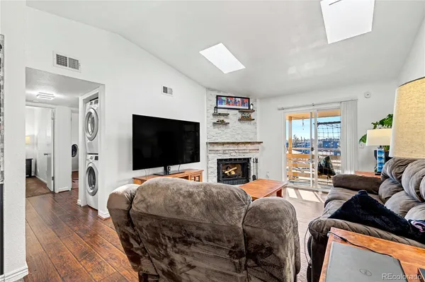 a bedroom with furniture and wooden floor