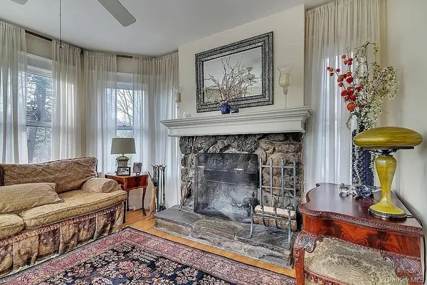 a living room with furniture and a fireplace