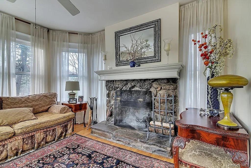 421 Spring Street Monroe, NY 10950 - Photo 15 of 49 a living room with furniture and a fireplace