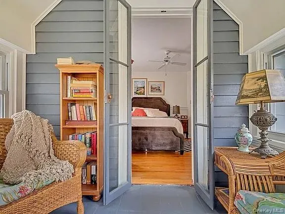 a bedroom with bed and a window