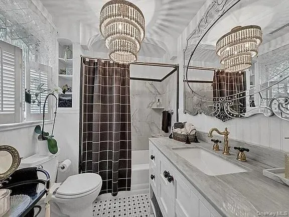a bathroom with a sink mirror and vanity