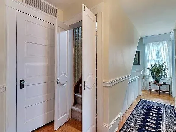 a room with gym equipment and view of living room