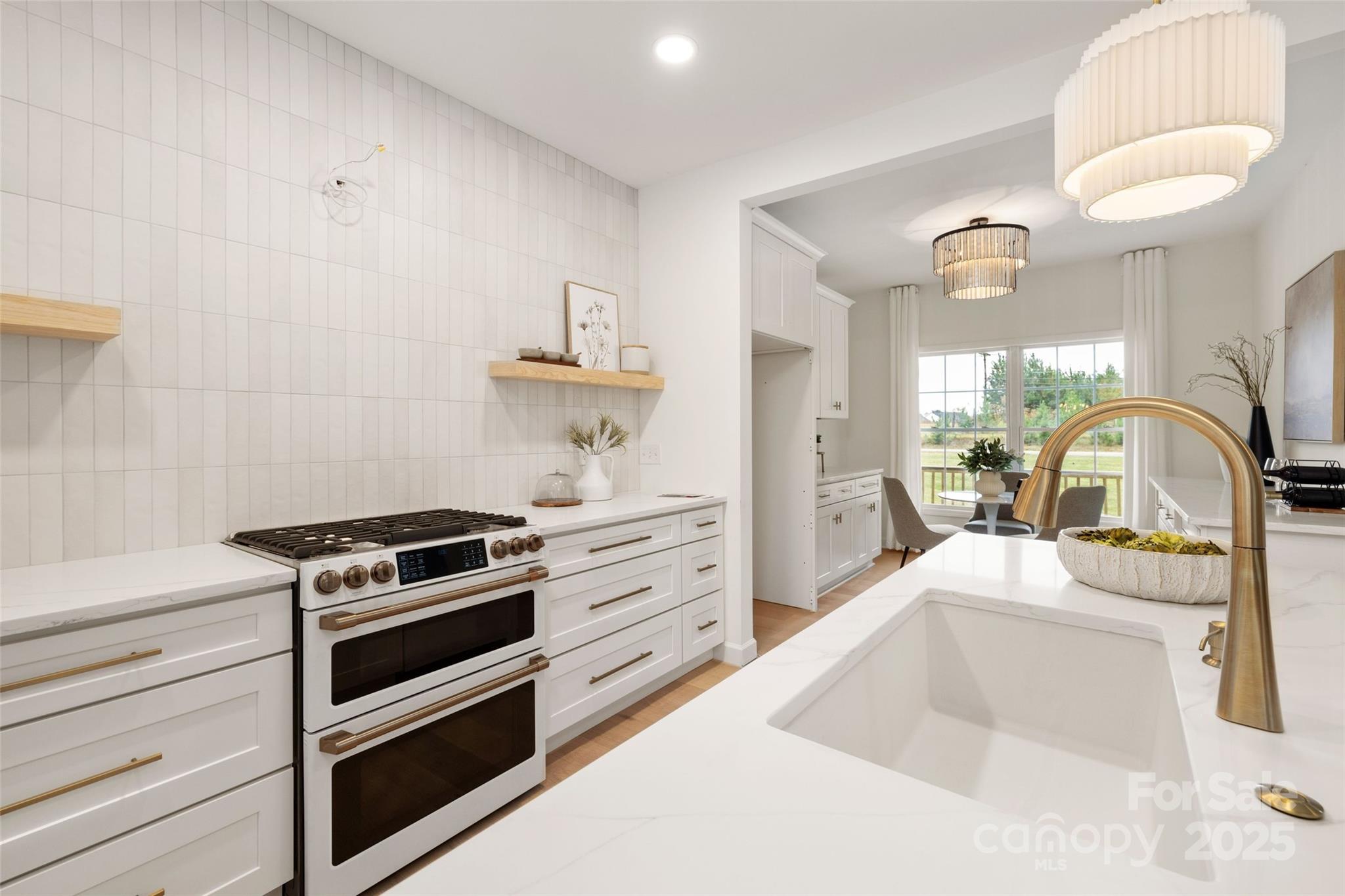 15906 Youngblood Road Charlotte, NC 28278 - Photo 11 of 41 a kitchen with a stove and a sink