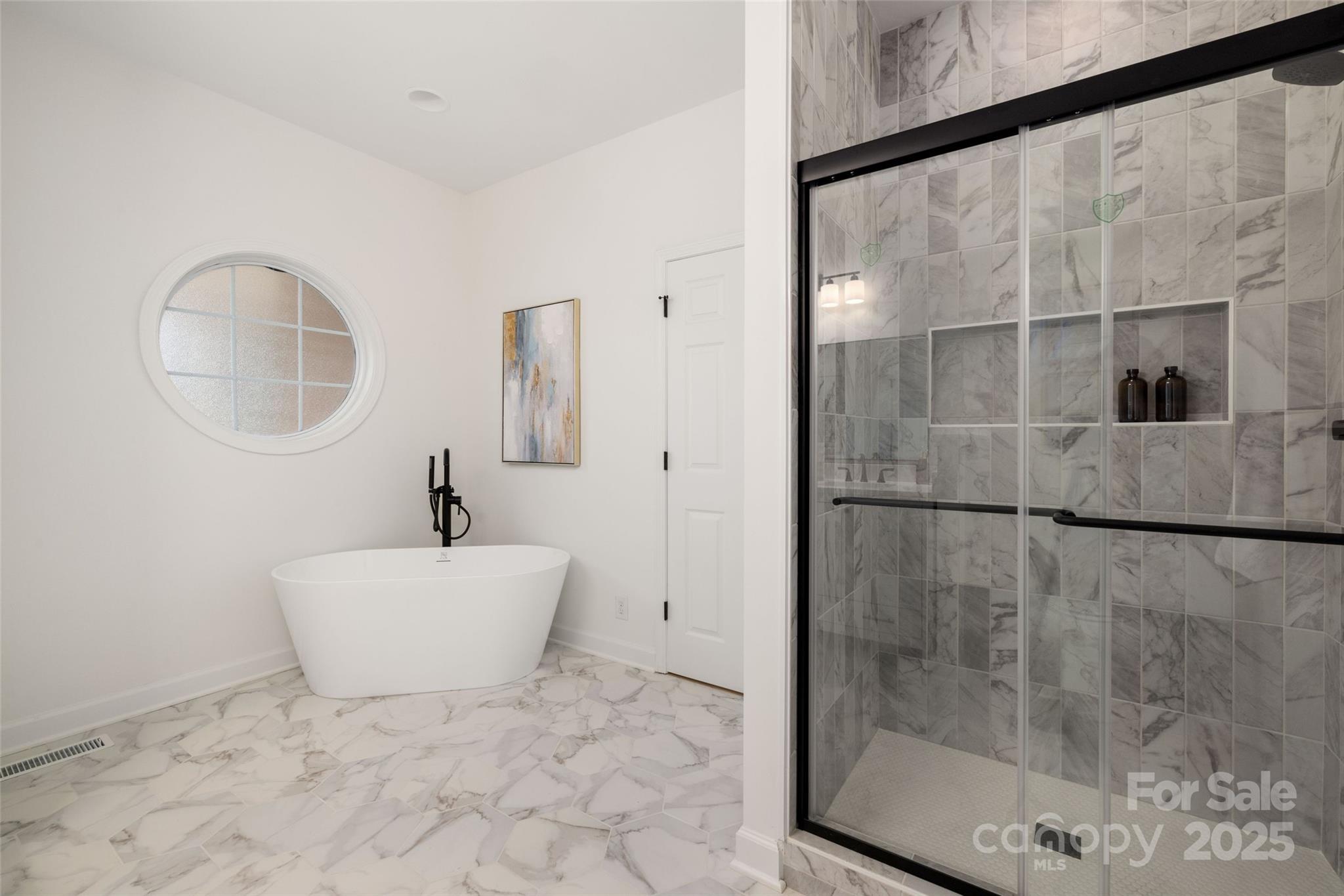 15906 Youngblood Road Charlotte, NC 28278 - Photo 16 of 41 a bathroom with a bathtub and shower