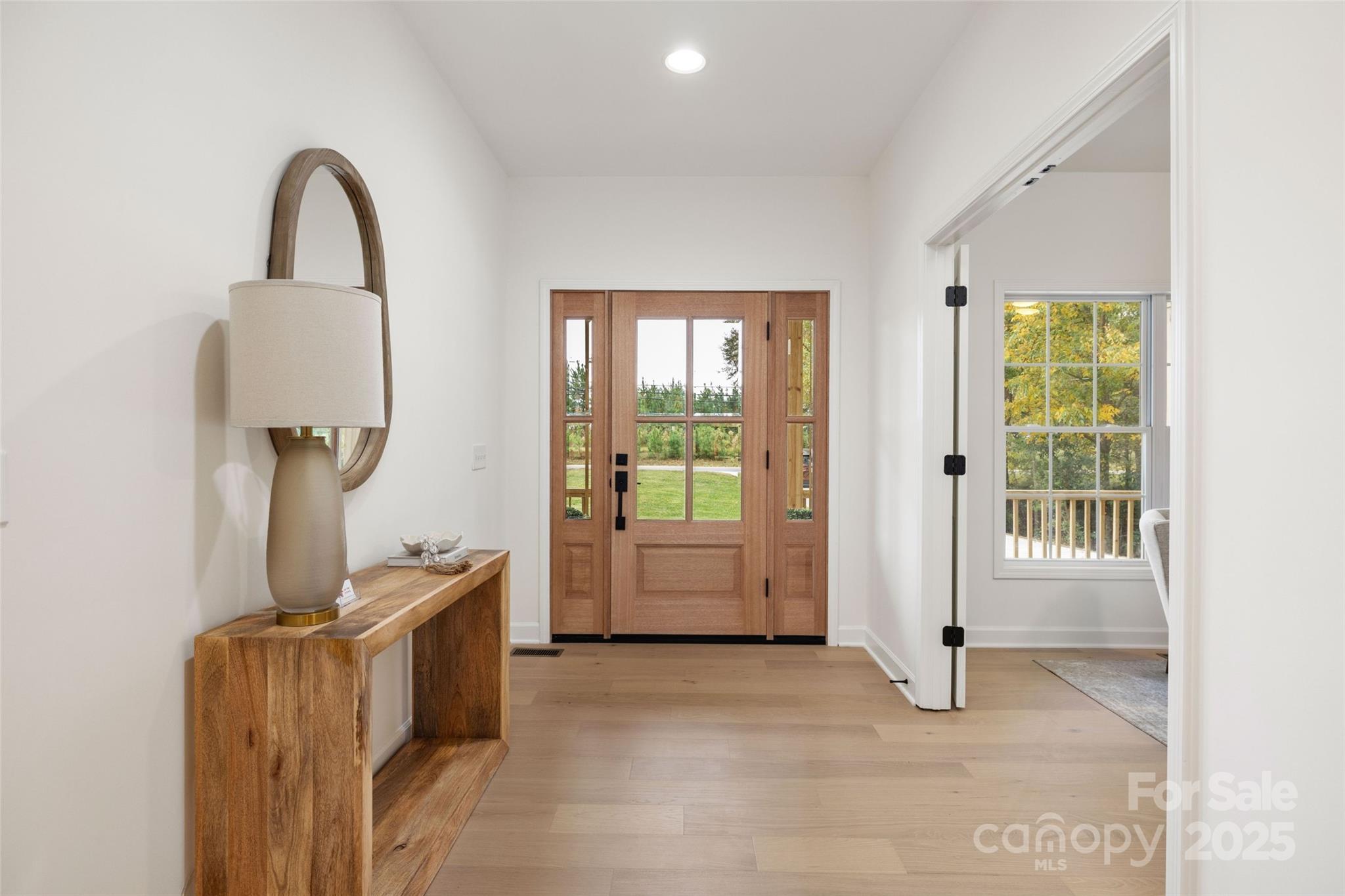 15906 Youngblood Road Charlotte, NC 28278 - Photo 3 of 41 a room with furniture and a window