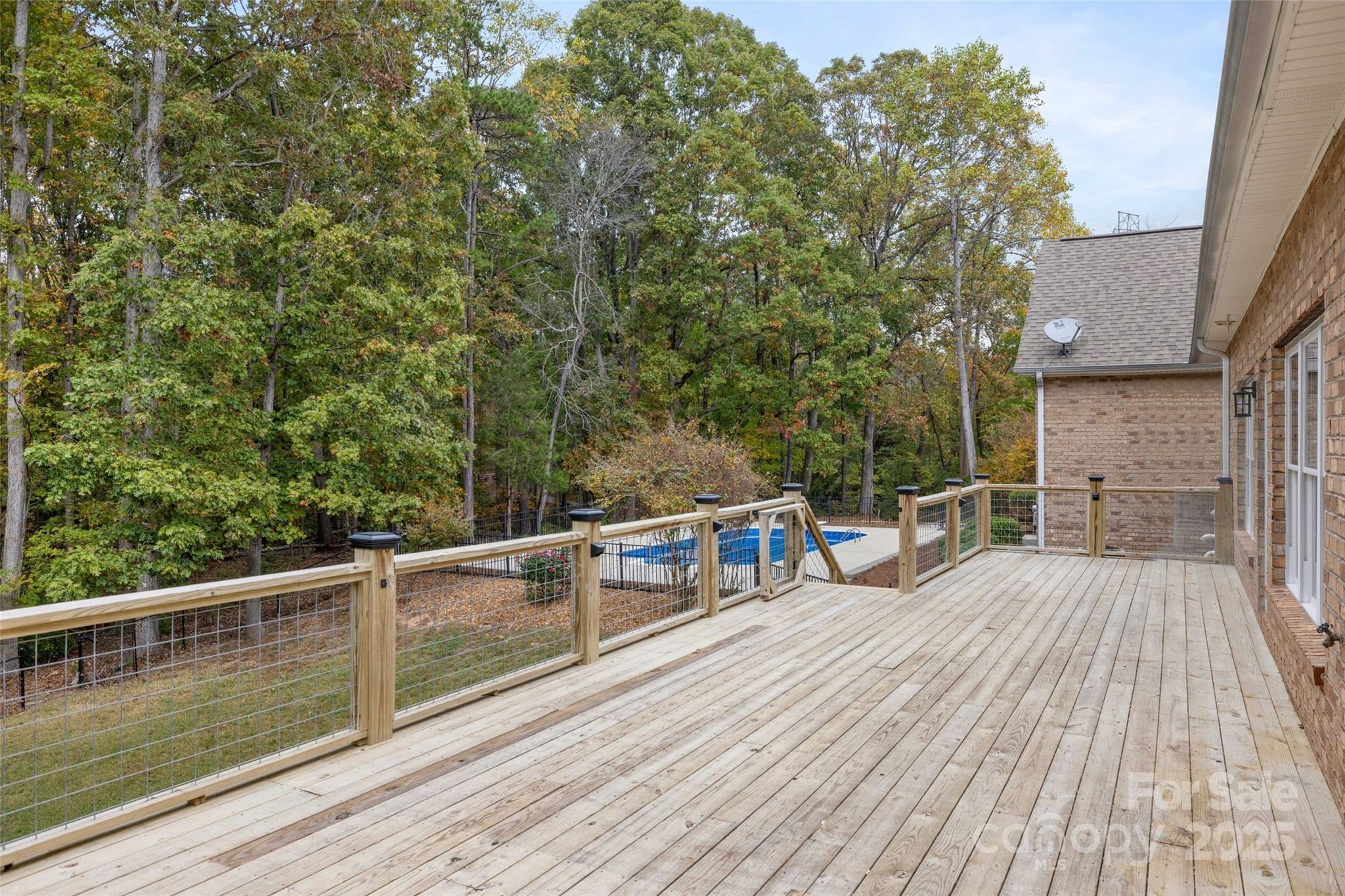 15906 Youngblood Road Charlotte, NC 28278 - Photo 34 of 41 a view of a balcony with two chairs and wooden floor