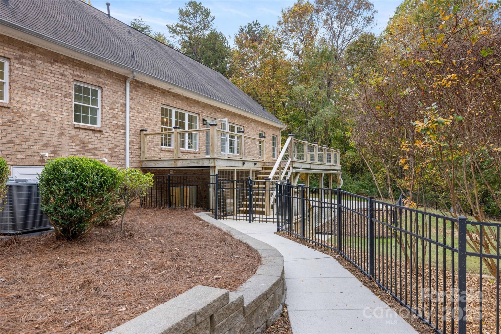 15906 Youngblood Road Charlotte, NC 28278 - Photo 36 of 41 a front view of a house with glass windows and garden