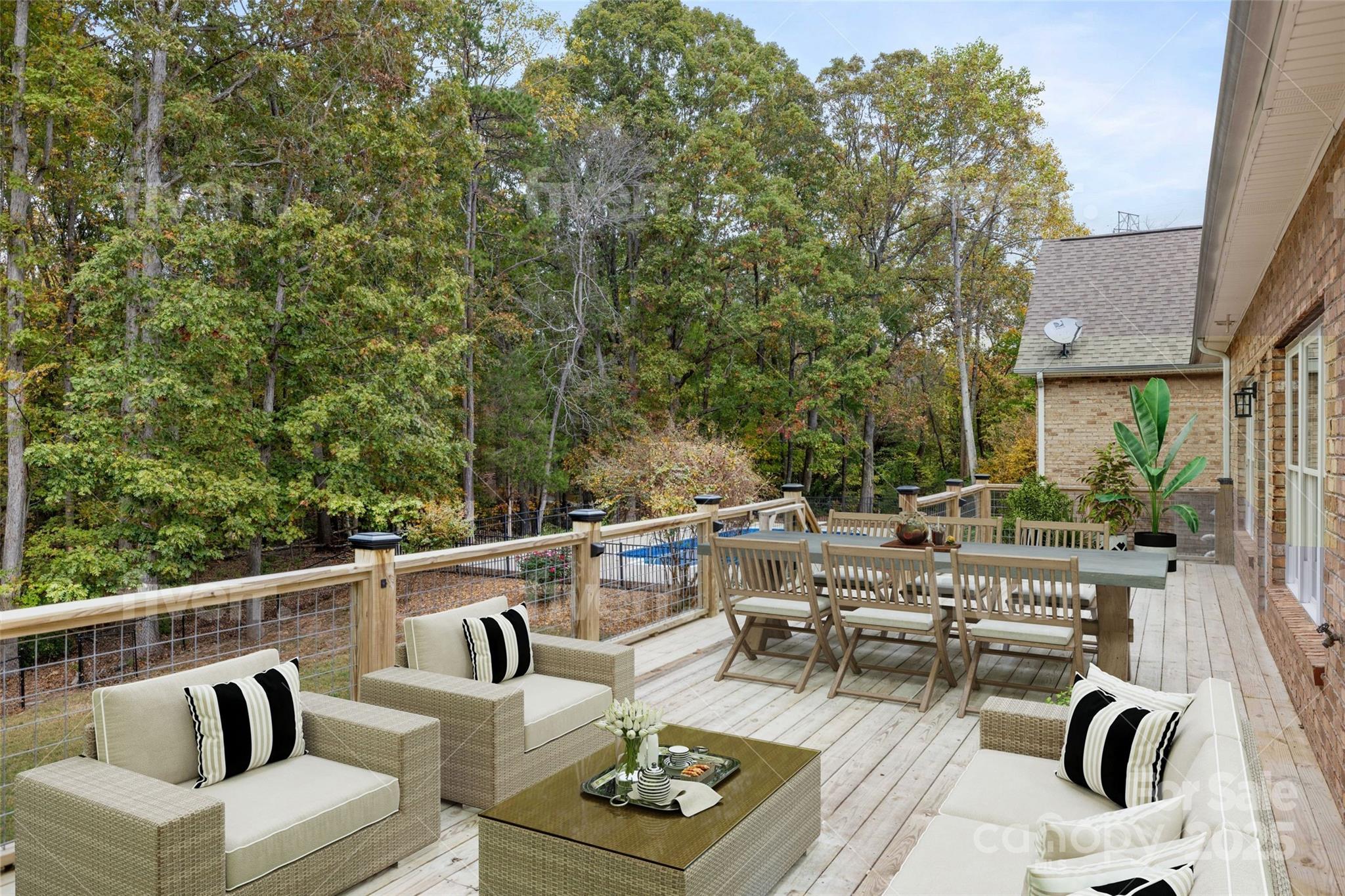 15906 Youngblood Road Charlotte, NC 28278 - Photo 41 of 41 a view of a patio with couches table and chairs and potted plants