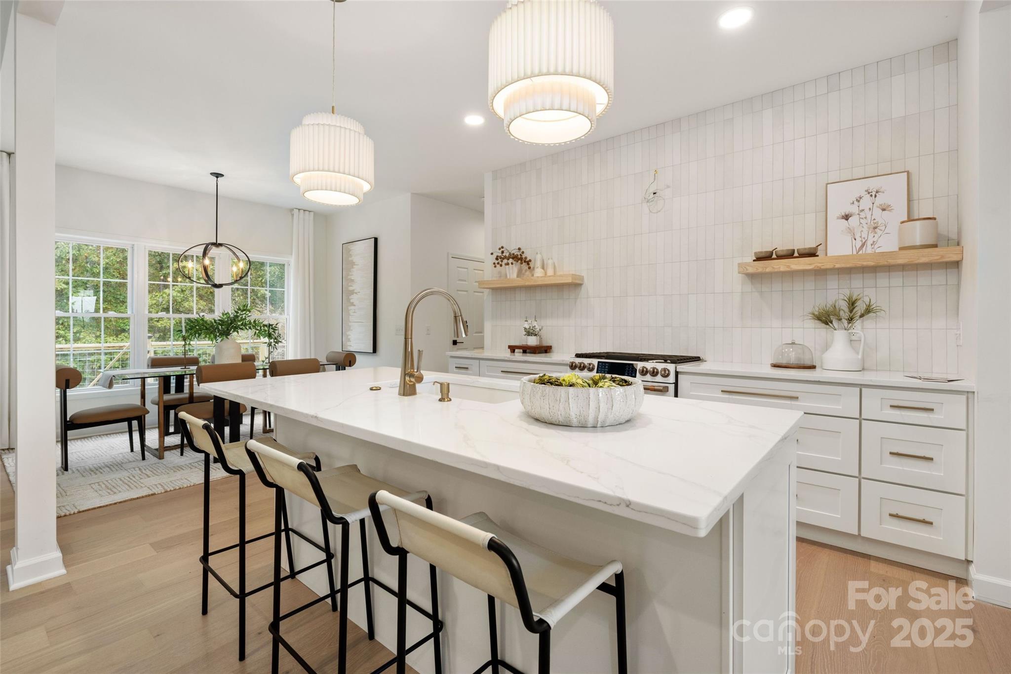 15906 Youngblood Road Charlotte, NC 28278 - Photo 10 of 41 a kitchen with a table and chairs in it