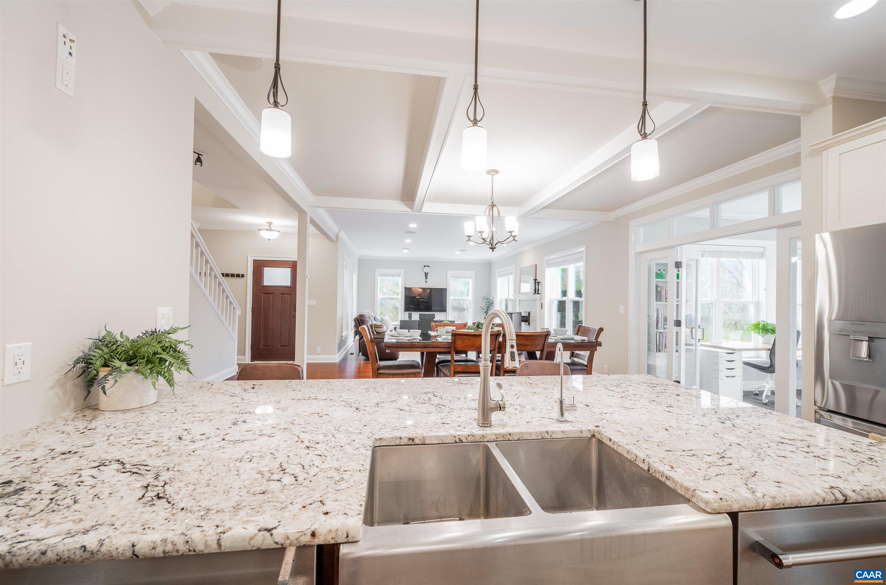 303 Turkey Ridge Road Charlottesville, VA 22903 - Photo 14 of 49 a kitchen with a table a sink and living room view