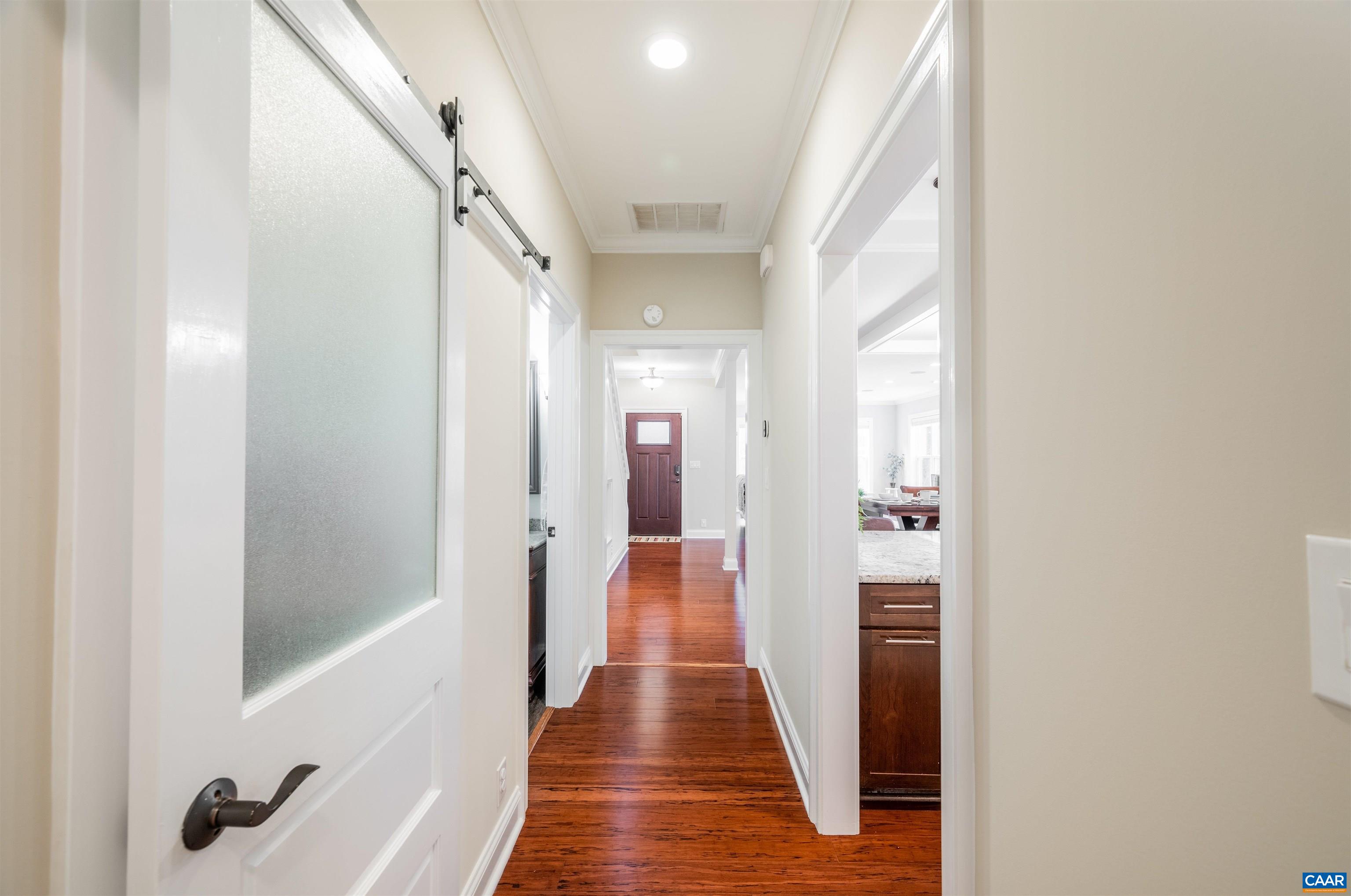 303 Turkey Ridge Road Charlottesville, VA 22903 - Photo 18 of 49 a view of a hallway with wooden floor and staircase