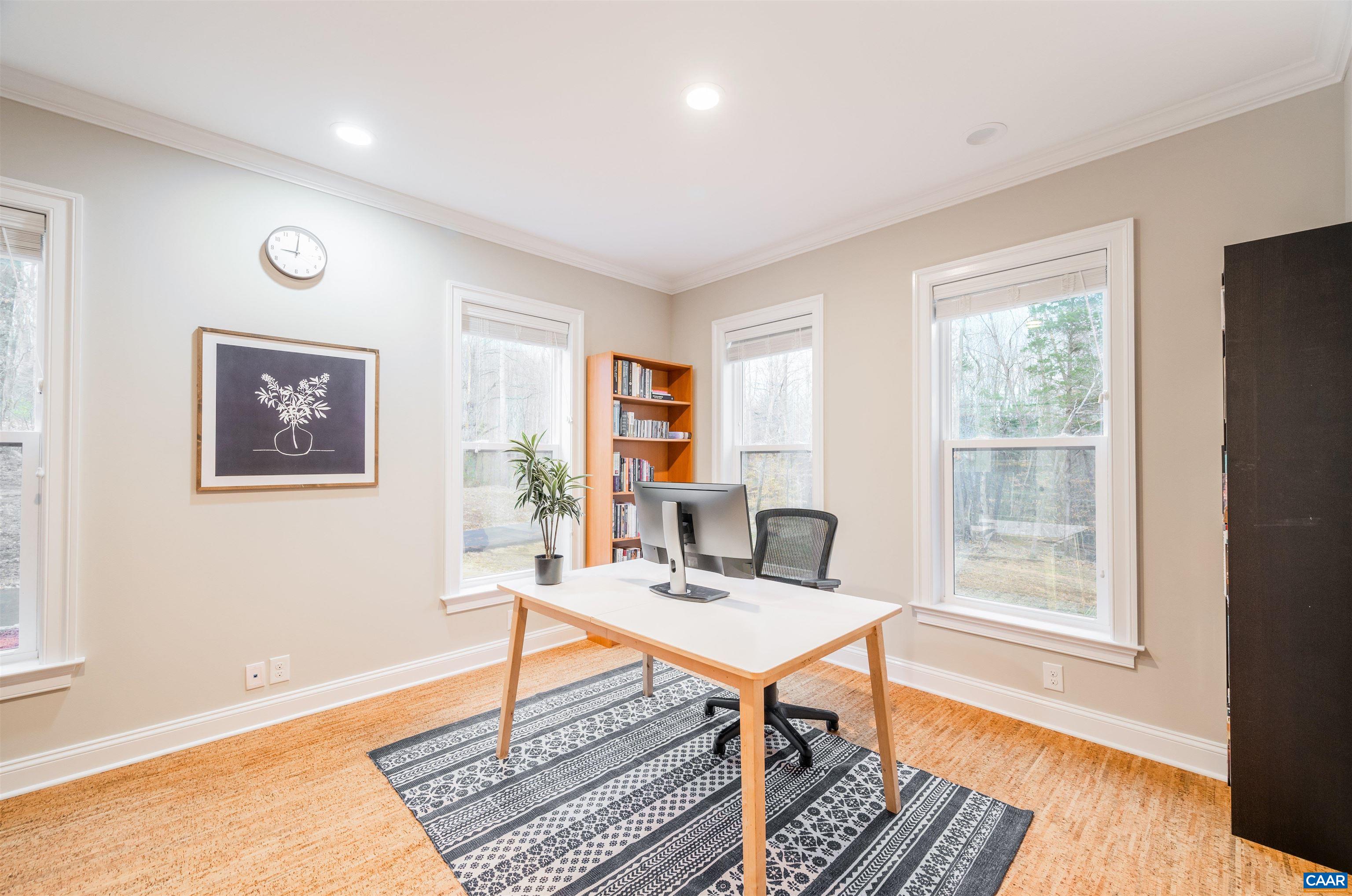 303 Turkey Ridge Road Charlottesville, VA 22903 - Photo 19 of 49 a work room with furniture wooden floor and a window