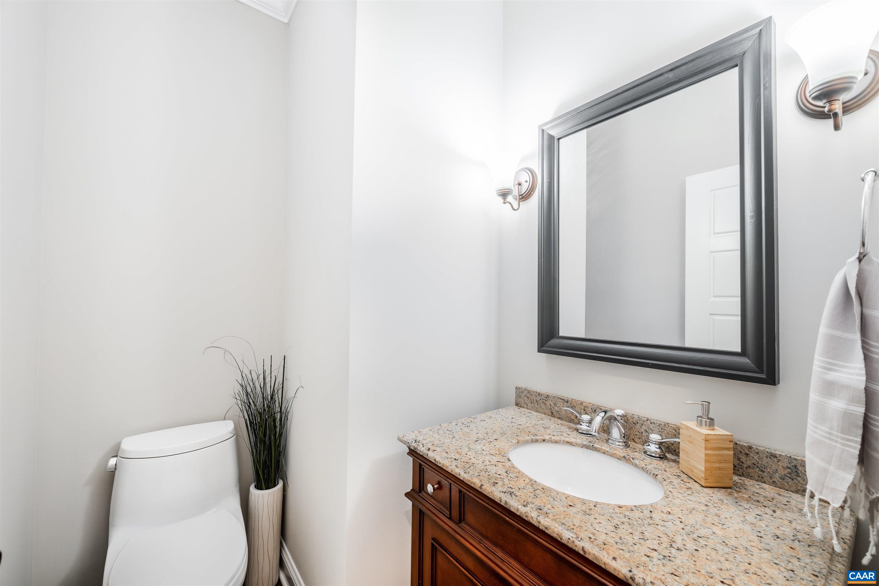 303 Turkey Ridge Road Charlottesville, VA 22903 - Photo 21 of 49 a bathroom with a granite countertop sink vanity mirror and toilet