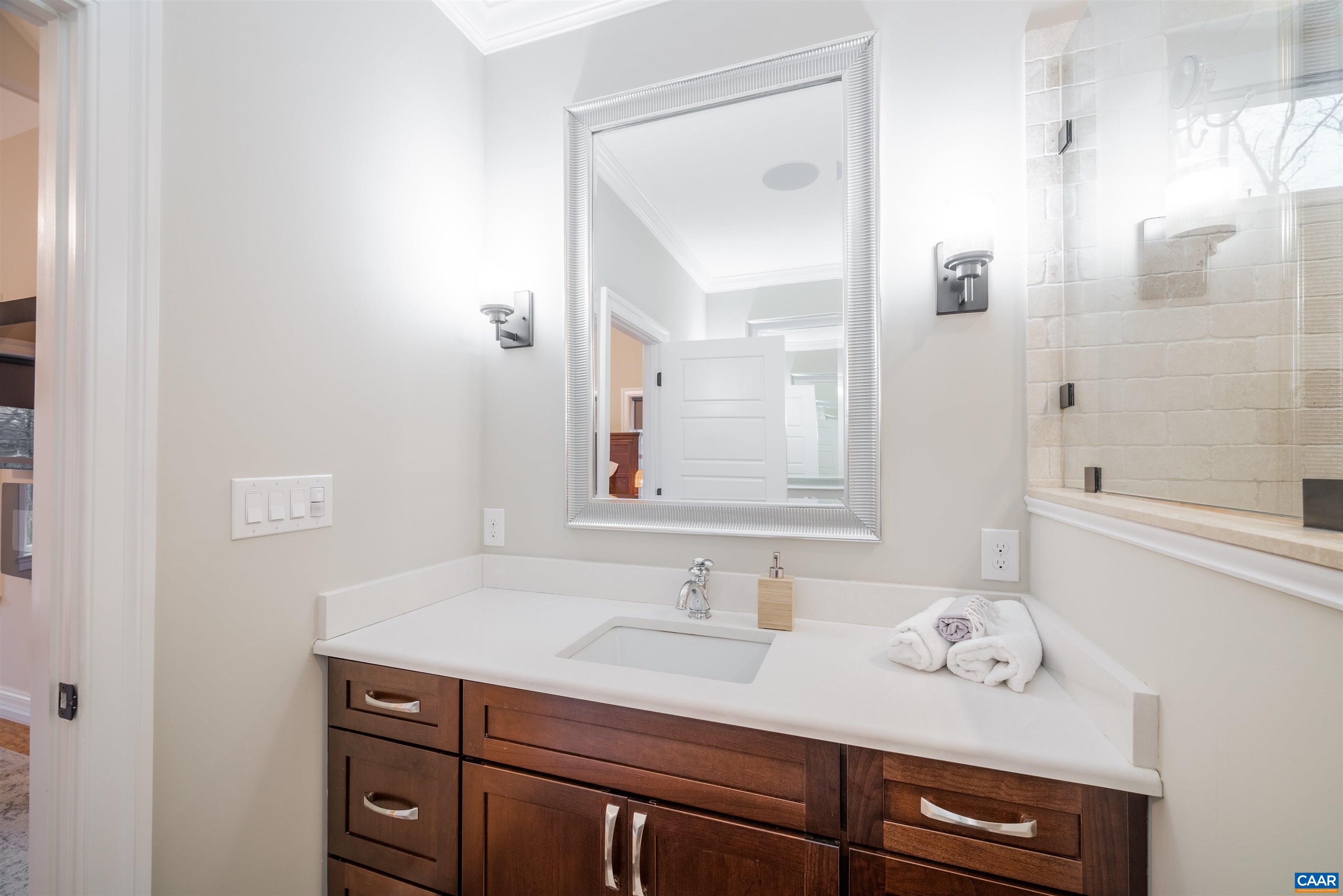 303 Turkey Ridge Road Charlottesville, VA 22903 - Photo 27 of 49 a bathroom with a sink vanity granite shower and a mirror