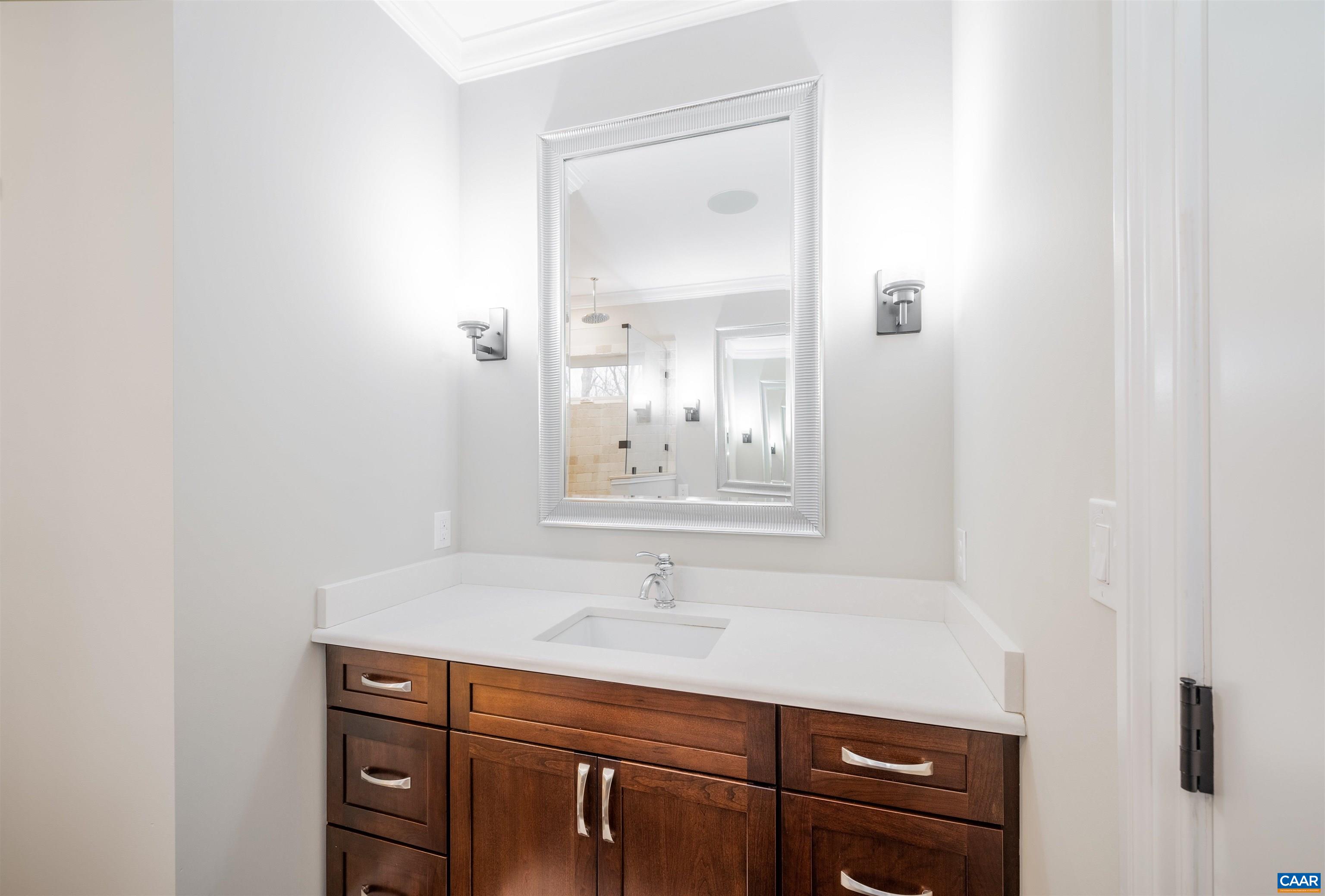 303 Turkey Ridge Road Charlottesville, VA 22903 - Photo 28 of 49 a bathroom with a sink a vanity and a mirror