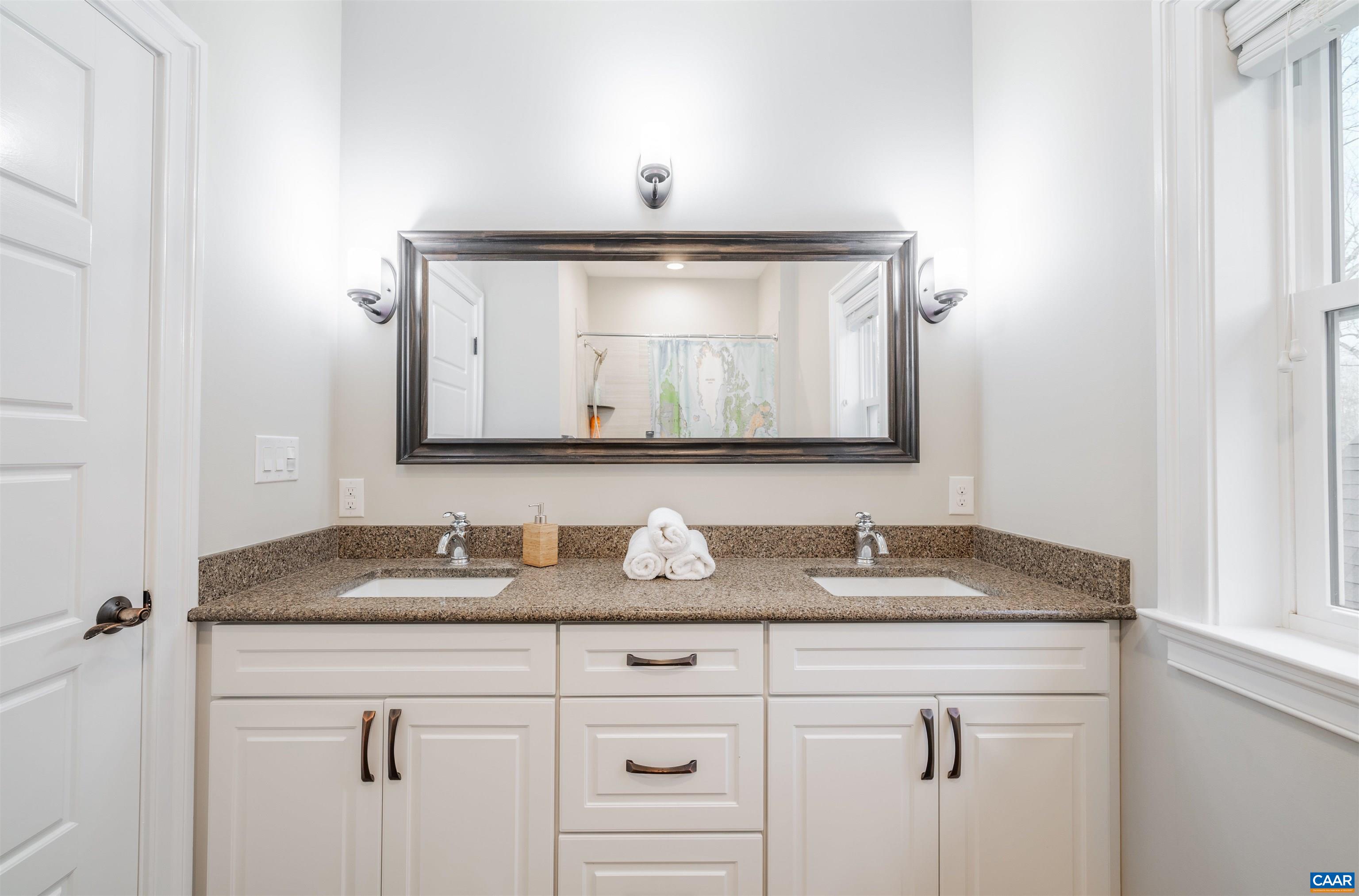 303 Turkey Ridge Road Charlottesville, VA 22903 - Photo 34 of 49 a bathroom with a sink and a mirror