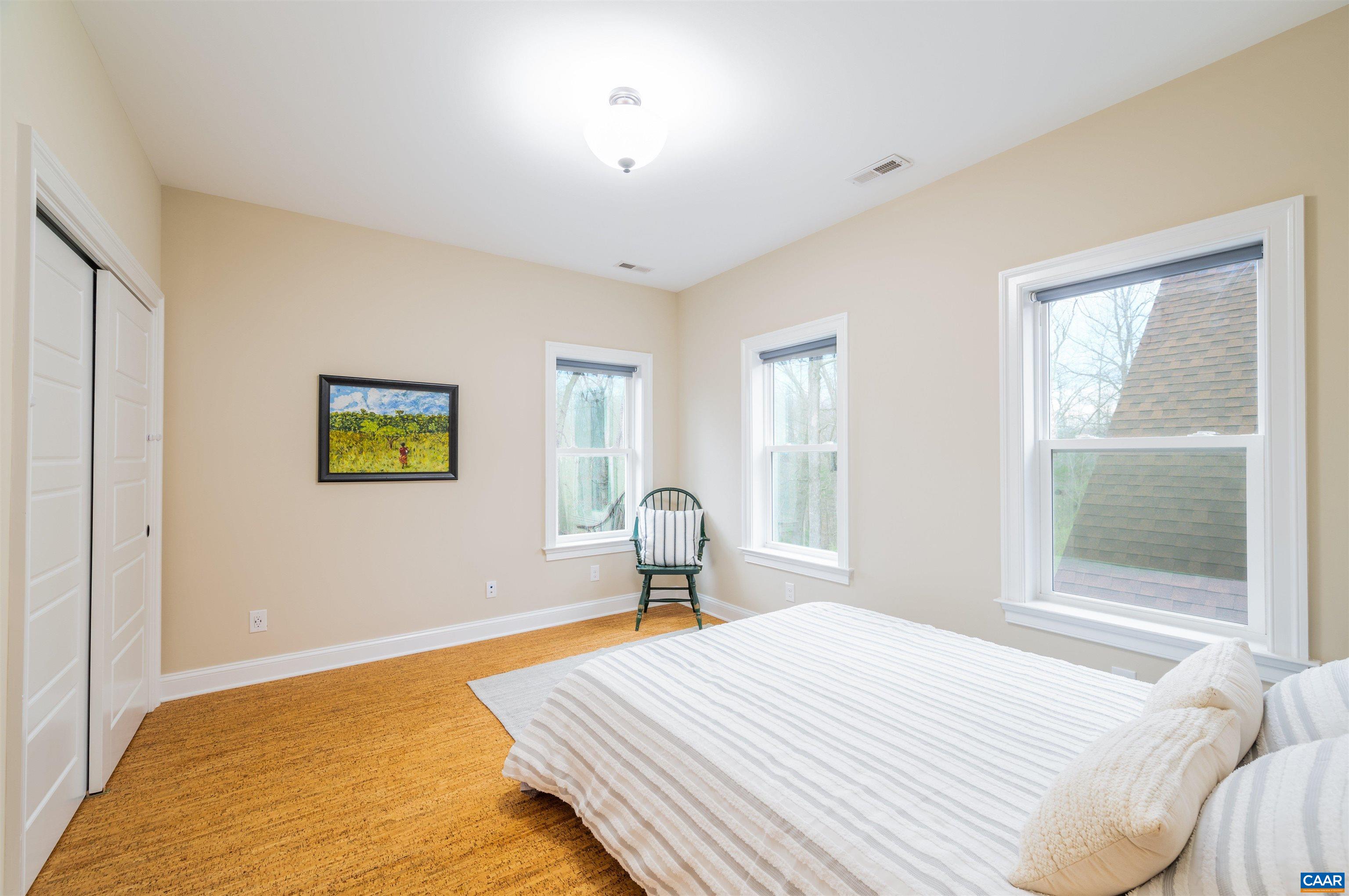 303 Turkey Ridge Road Charlottesville, VA 22903 - Photo 35 of 49 a bedroom with a bed and a window