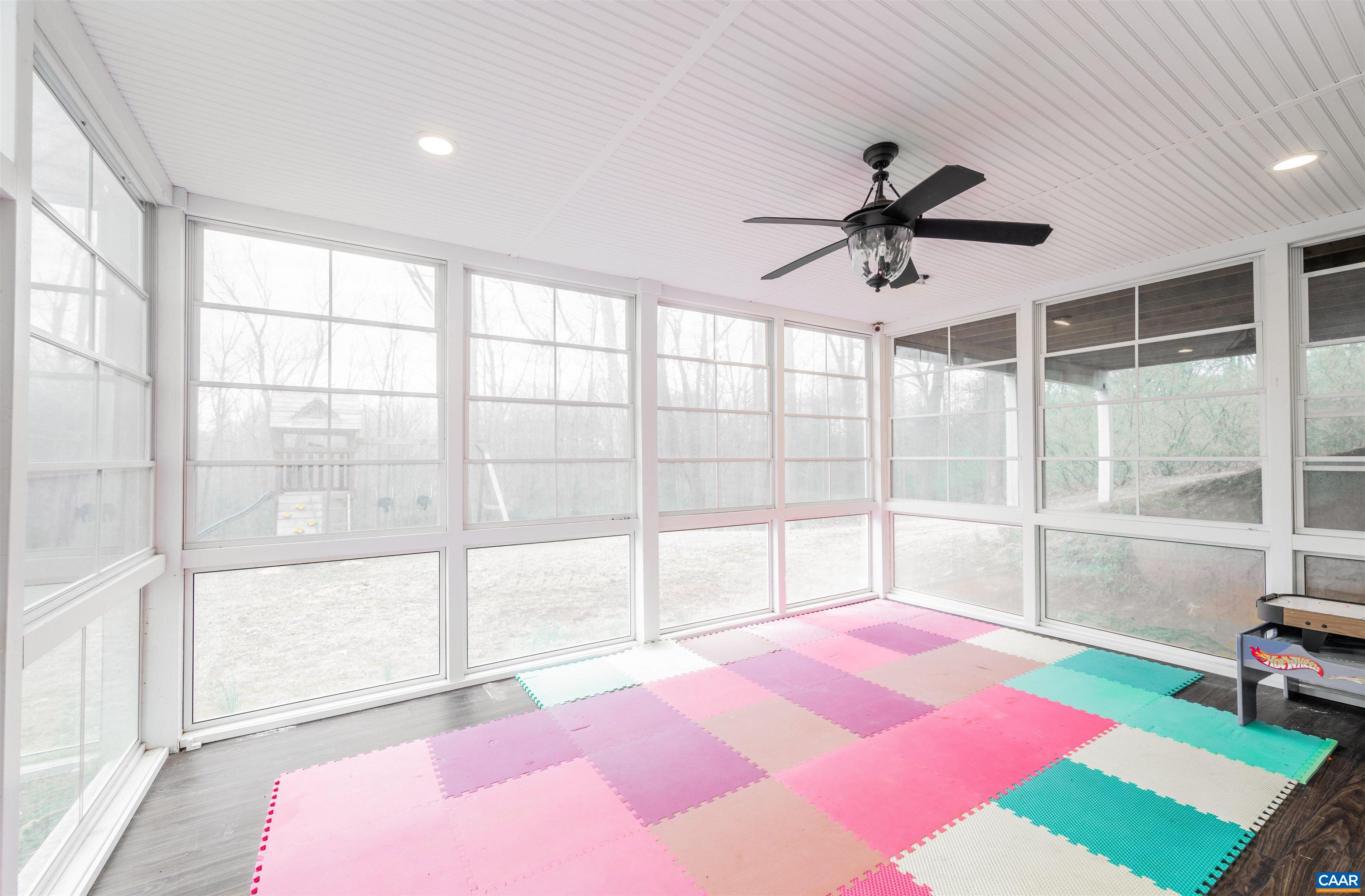 303 Turkey Ridge Road Charlottesville, VA 22903 - Photo 40 of 49 a bedroom with a bed and a large window with outer view