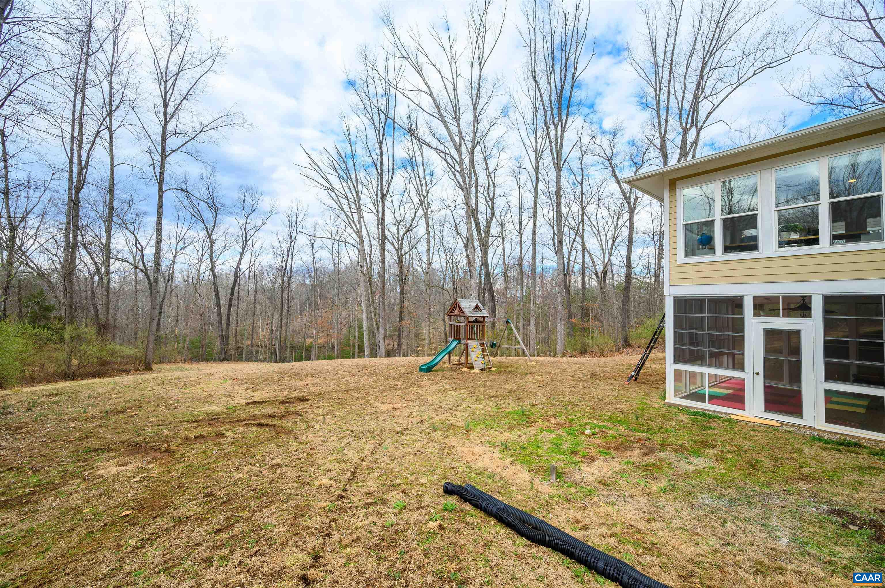 303 Turkey Ridge Road Charlottesville, VA 22903 - Photo 42 of 49 a view of a house with backyard and trees