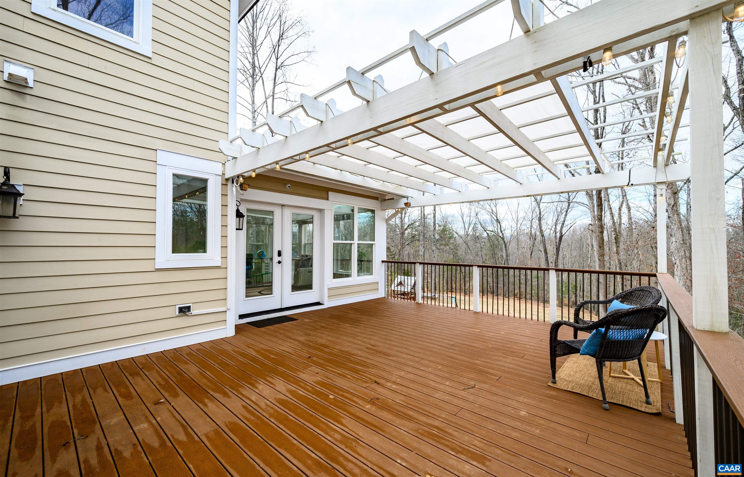 303 Turkey Ridge Road Charlottesville, VA 22903 - Photo 43 of 49 a view of a roof deck with wooden floor and fence