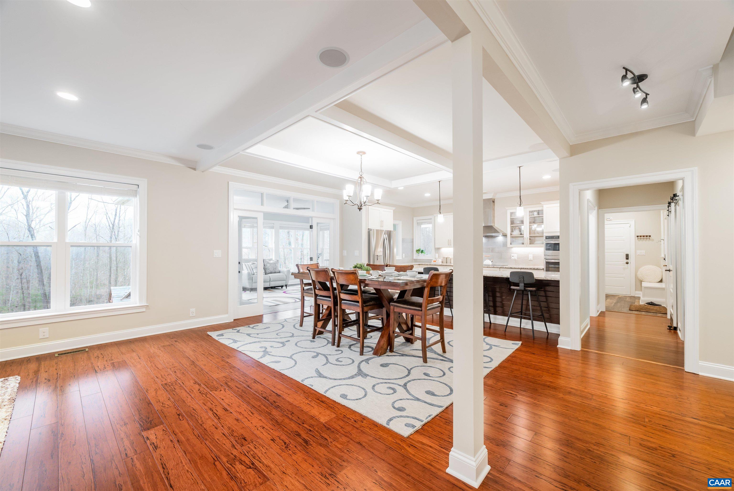 303 Turkey Ridge Road Charlottesville, VA 22903 - Photo 5 of 49 a view of a dining room with furniture and wooden floor