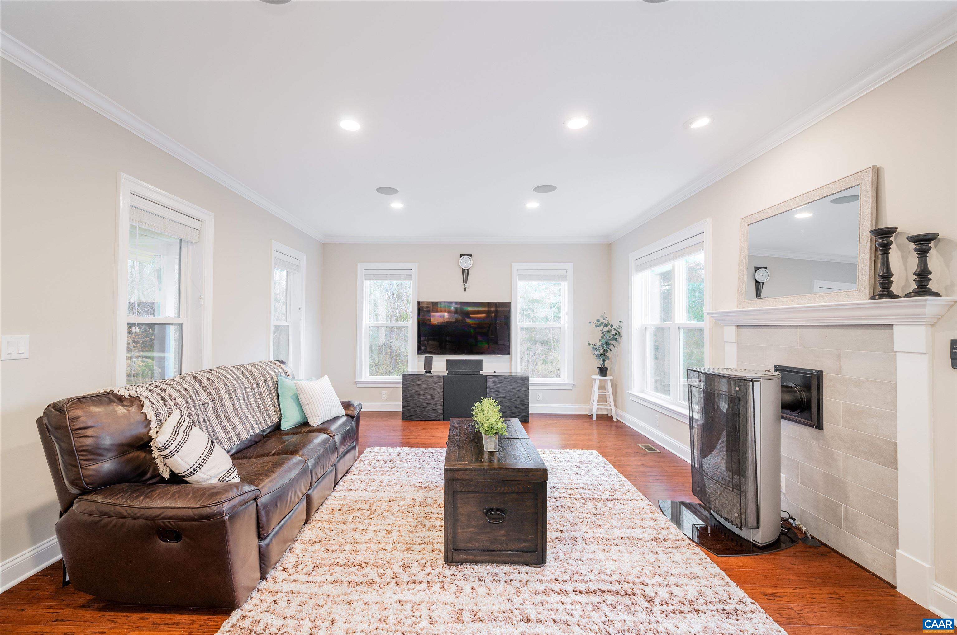 303 Turkey Ridge Road Charlottesville, VA 22903 - Photo 7 of 49 a living room with furniture and a fireplace