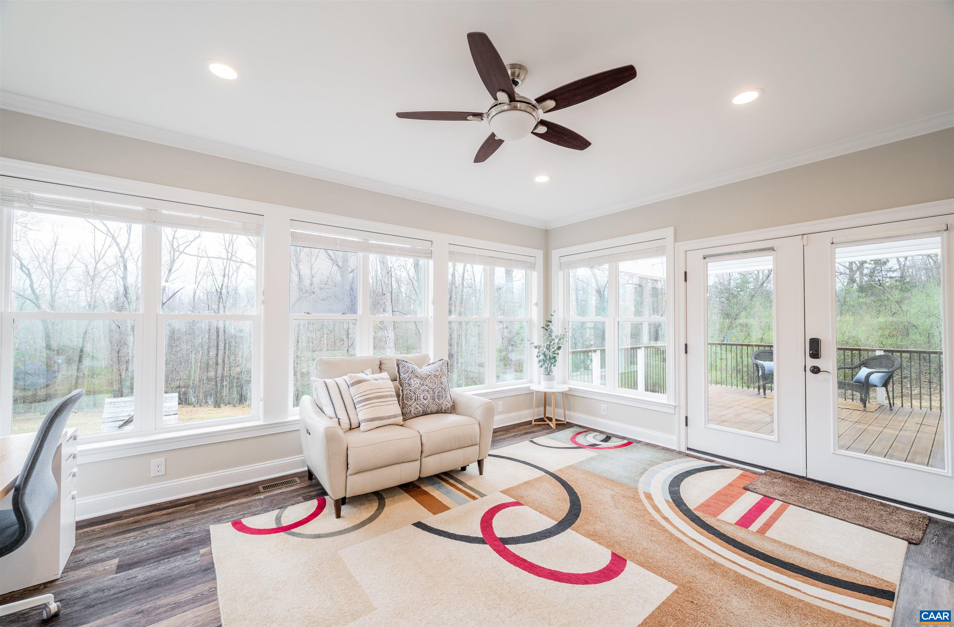 303 Turkey Ridge Road Charlottesville, VA 22903 - Photo 8 of 49 a living room with furniture and a large window