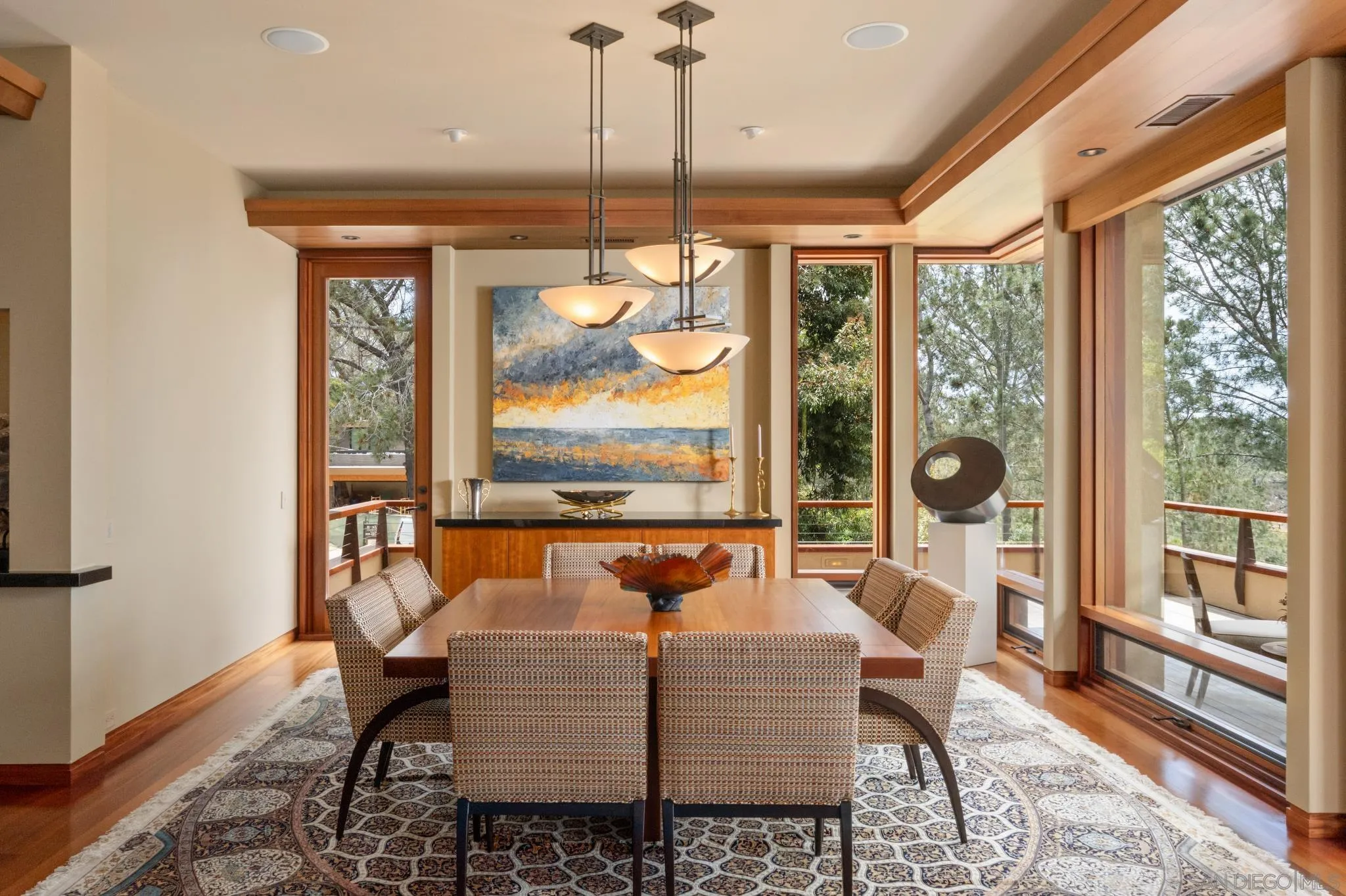 456 Hidden Pines Lane Del Mar, CA 92014 - Photo 13 of 55 a dining room with furniture large windows and wooden floor