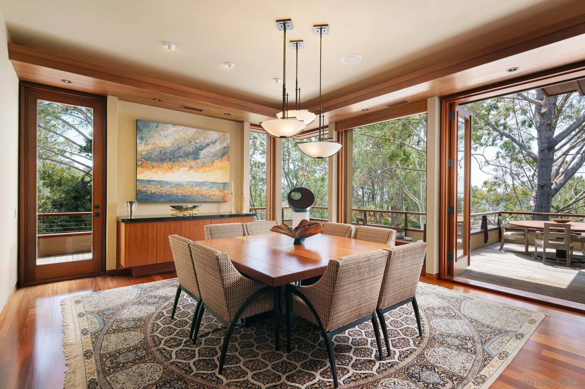 456 Hidden Pines Lane Del Mar, CA 92014 - Photo 14 of 55 a dining room with furniture large windows and a chandelier