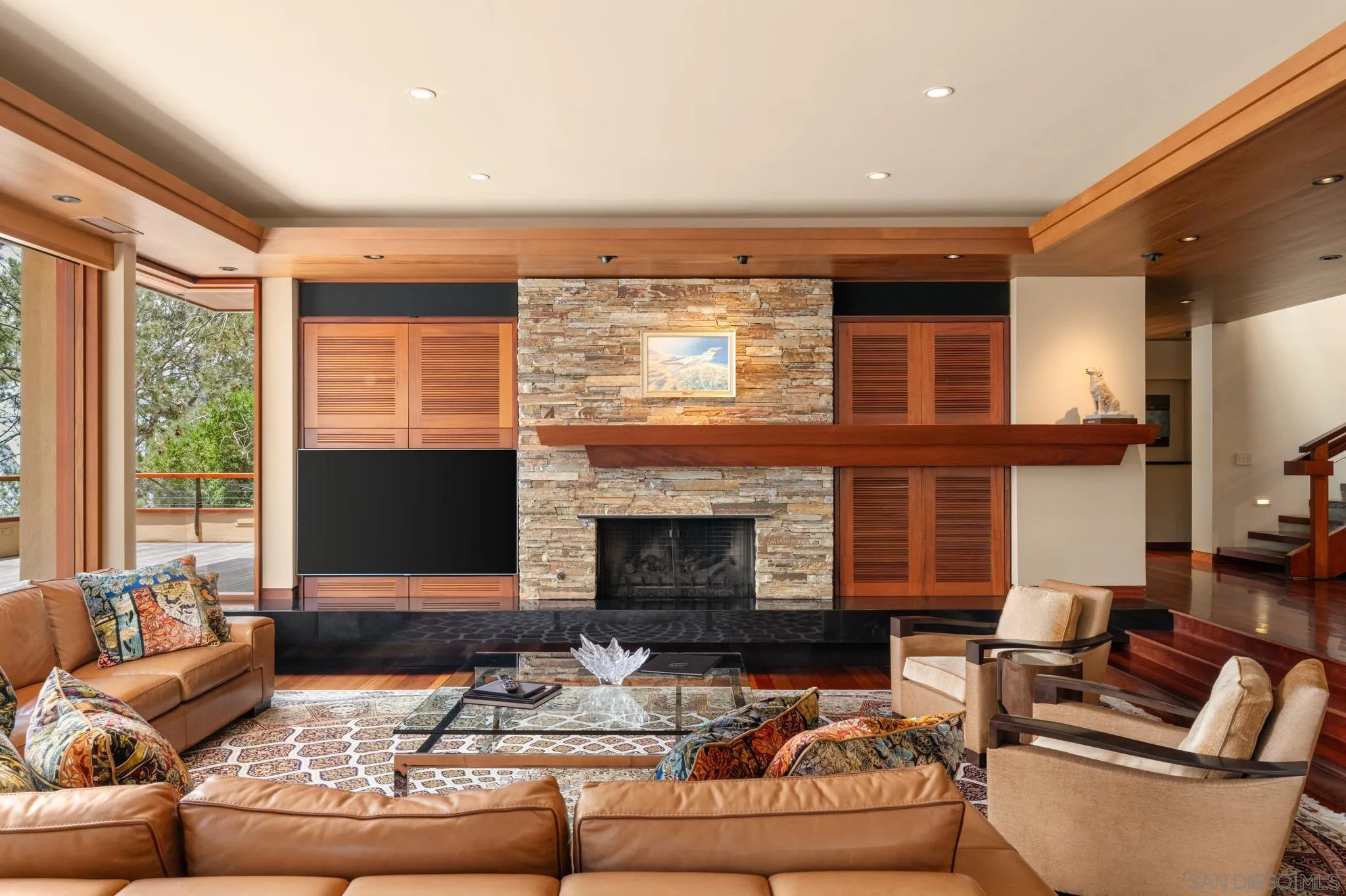 456 Hidden Pines Lane Del Mar, CA 92014 - Photo 15 of 55 a living room with furniture fireplace and a flat screen tv