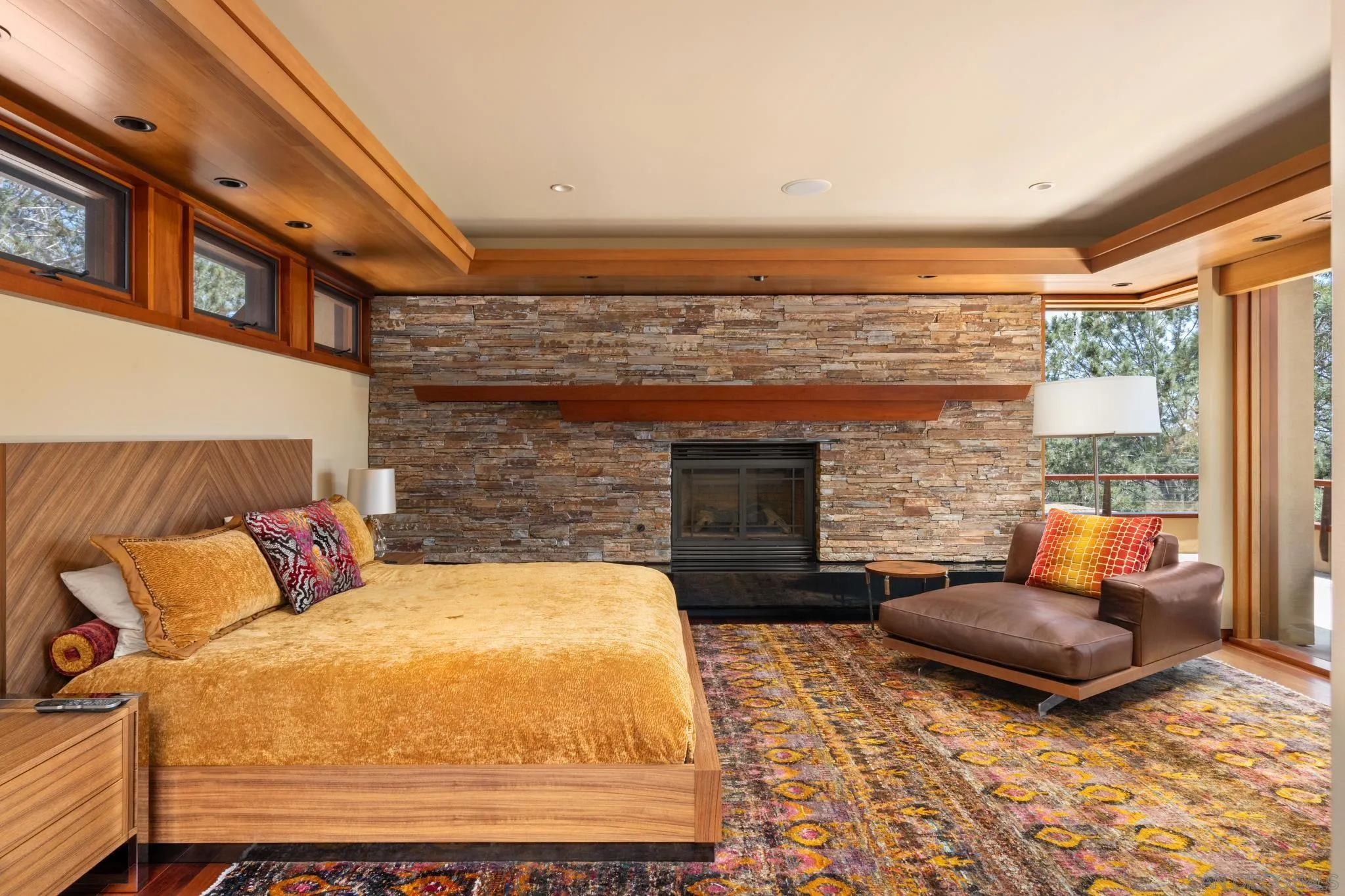 456 Hidden Pines Lane Del Mar, CA 92014 - Photo 23 of 55 a bedroom with furniture and a fireplace