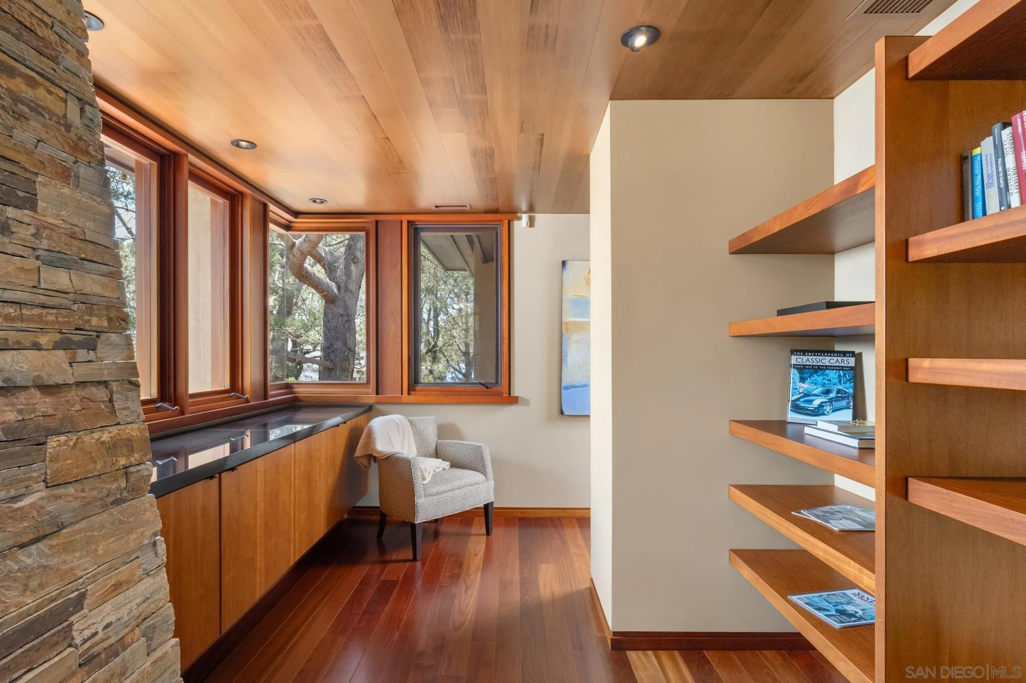 456 Hidden Pines Lane Del Mar, CA 92014 - Photo 28 of 55 a living room with a bed and a window with wooden floor
