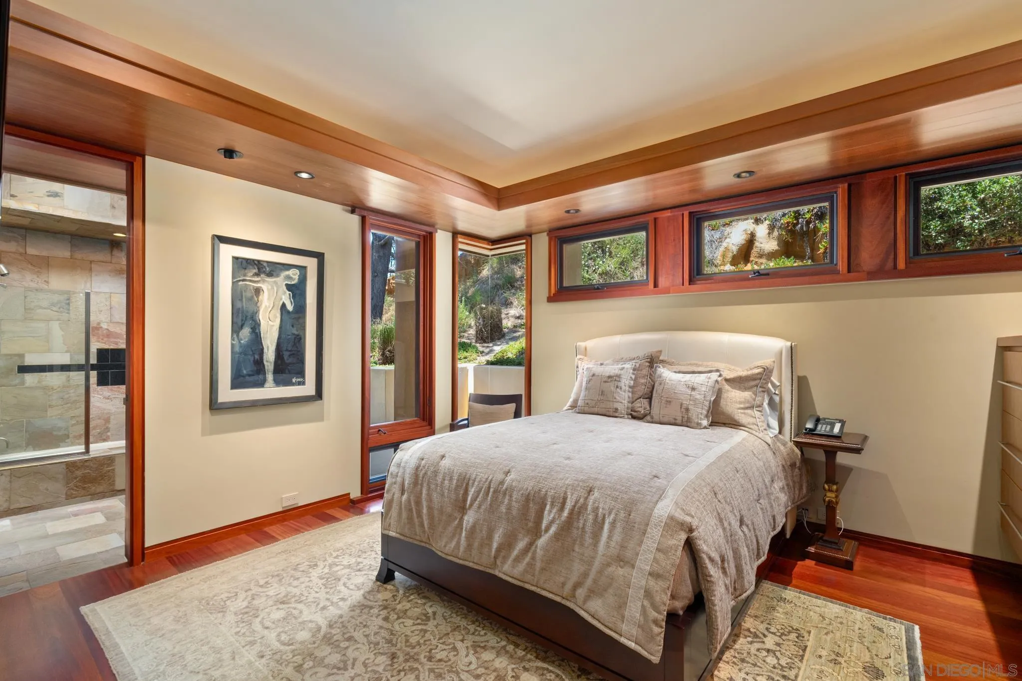 456 Hidden Pines Lane Del Mar, CA 92014 - Photo 30 of 55 a bedroom with a large bed and a window