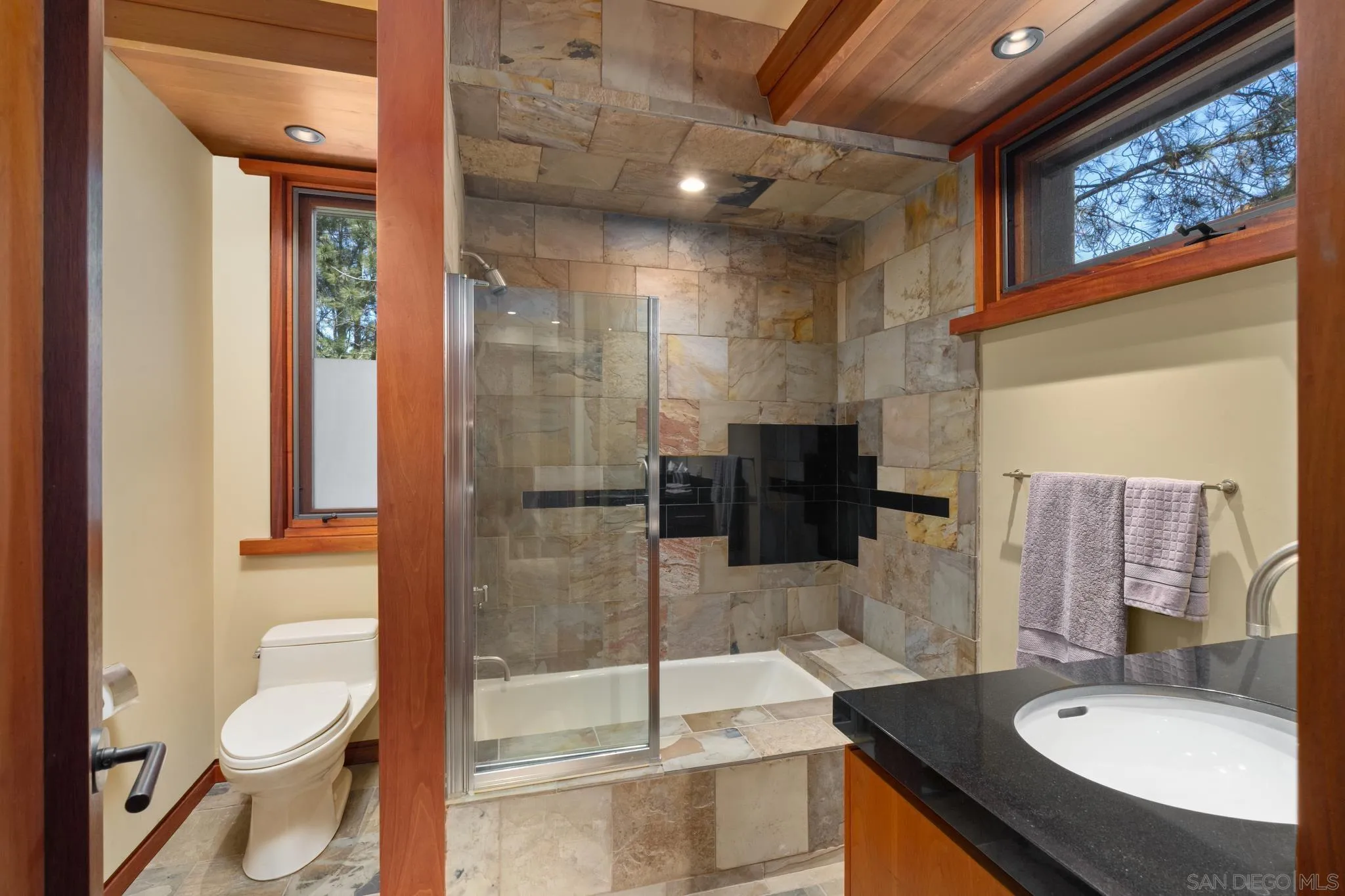 456 Hidden Pines Lane Del Mar, CA 92014 - Photo 31 of 55 a bathroom with a sink a toilet and shower