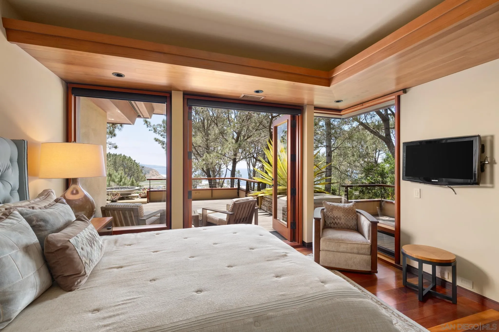 456 Hidden Pines Lane Del Mar, CA 92014 - Photo 35 of 55 a bedroom with a bed and glass window
