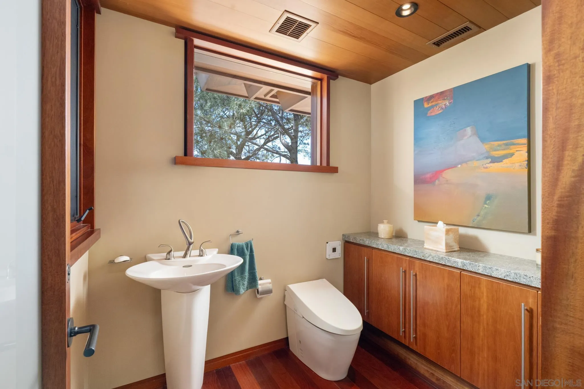 456 Hidden Pines Lane Del Mar, CA 92014 - Photo 36 of 55 a bathroom with a toilet sink and mirror