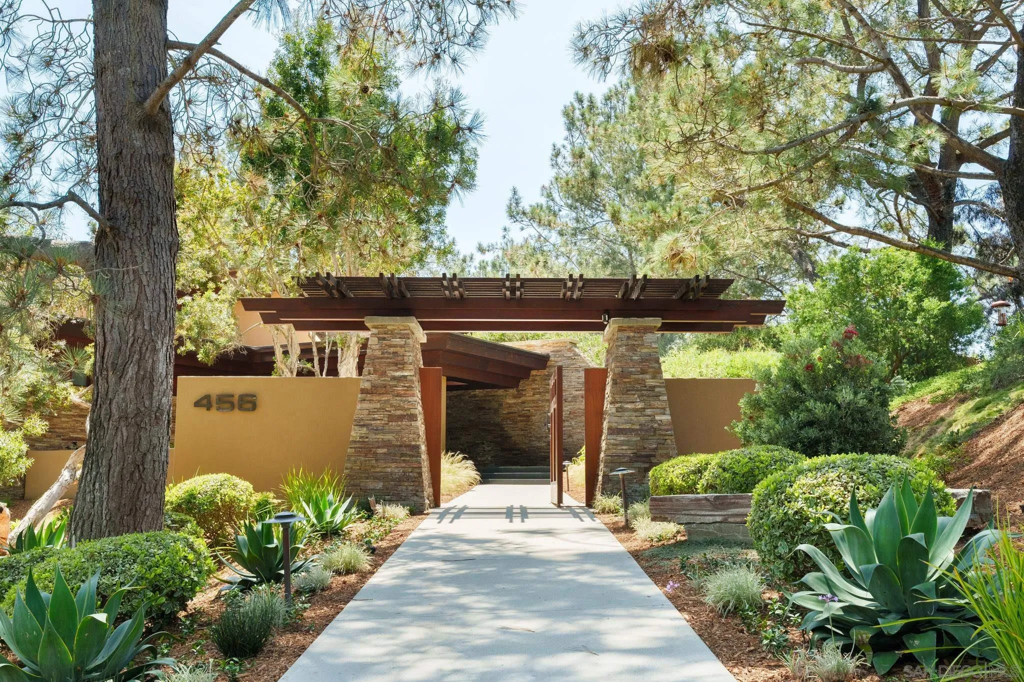 456 Hidden Pines Lane Del Mar, CA 92014 - Photo 40 of 55 a front view of a house with garden