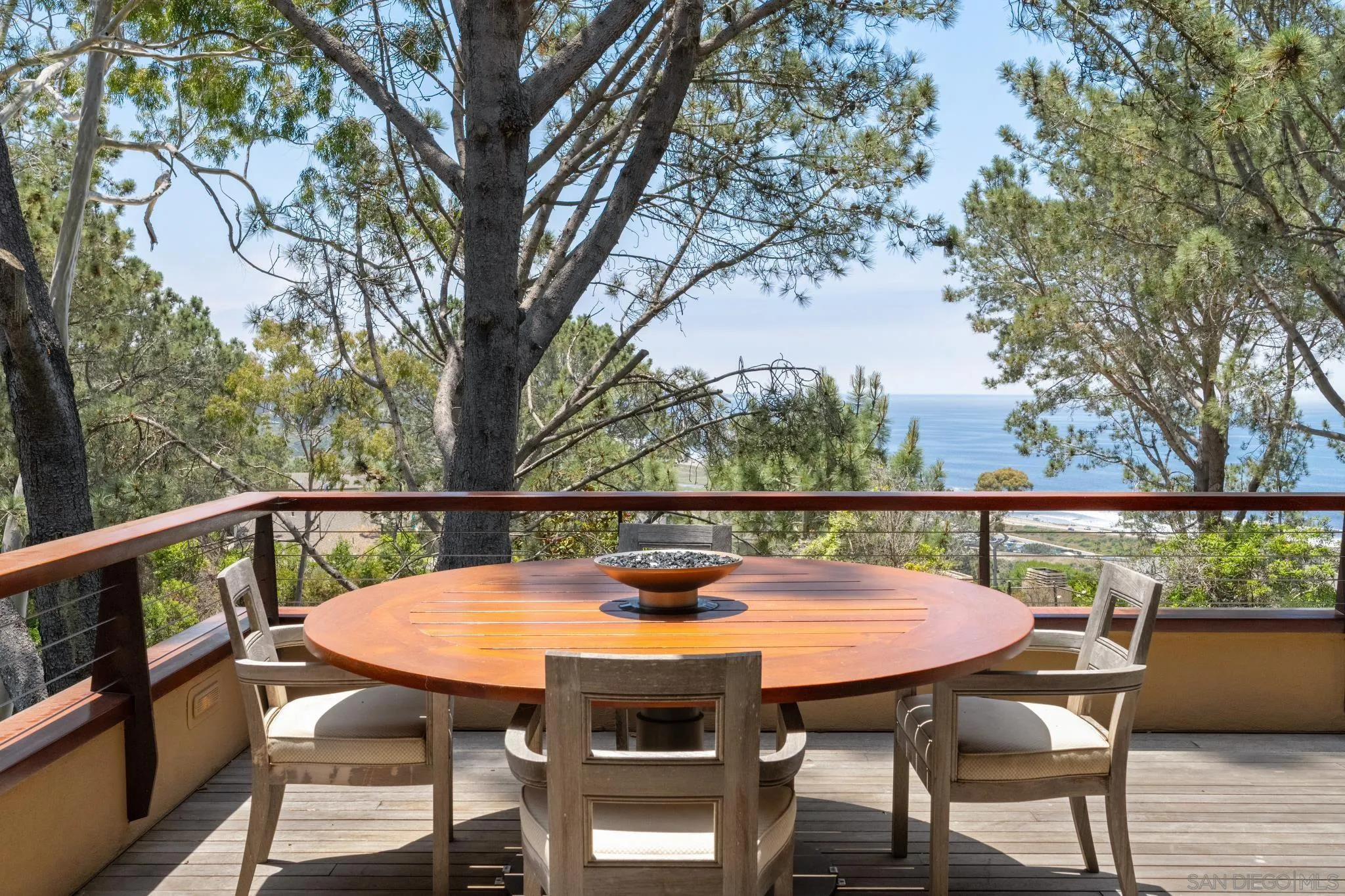456 Hidden Pines Lane Del Mar, CA 92014 - Photo 43 of 55 a view of a balcony with table and chairs
