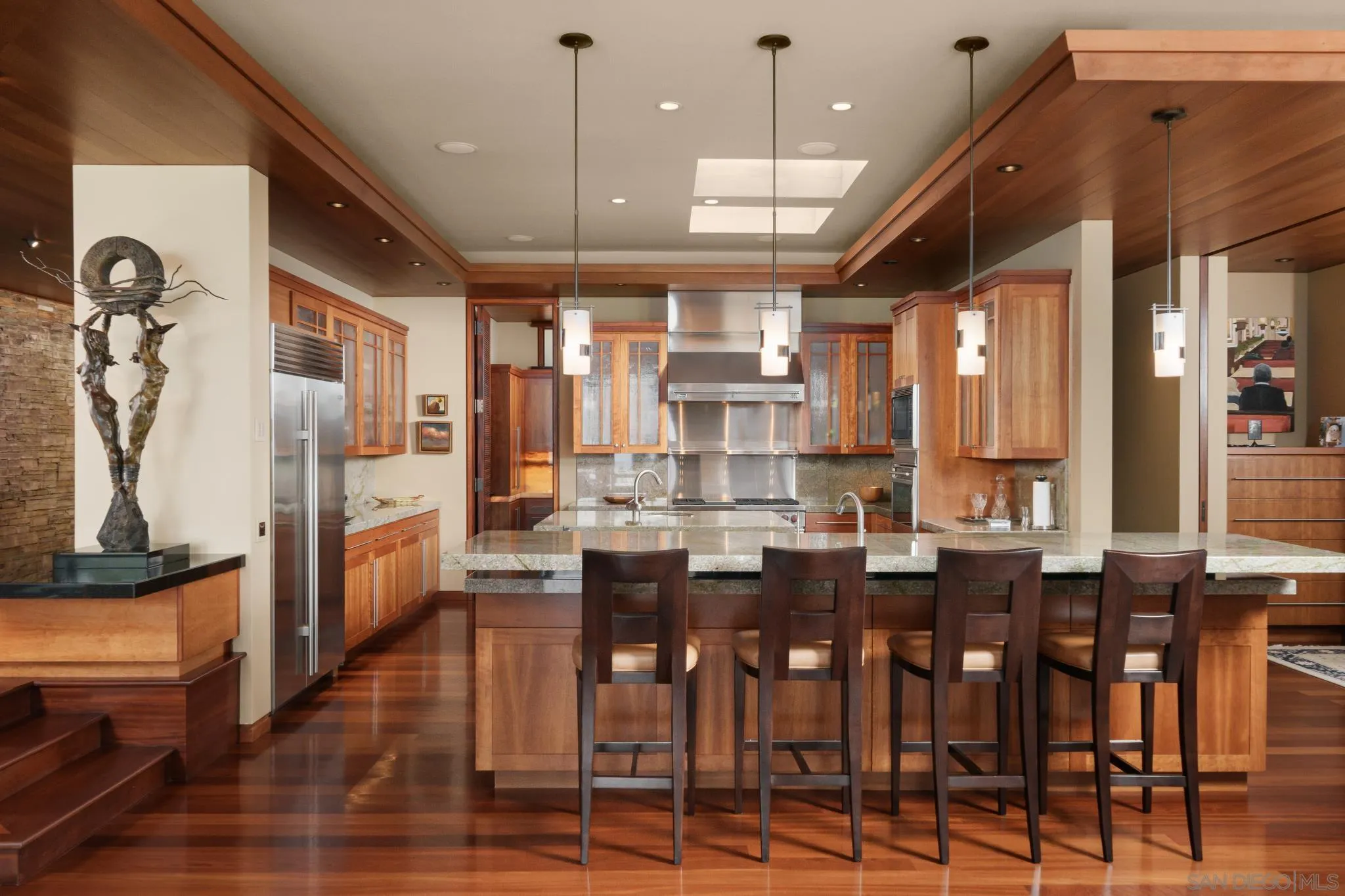 456 Hidden Pines Lane Del Mar, CA 92014 - Photo 10 of 55 a large kitchen with a table and chairs