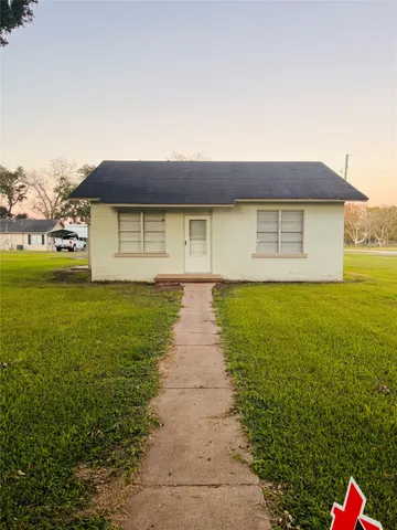 a front view of a house with yard