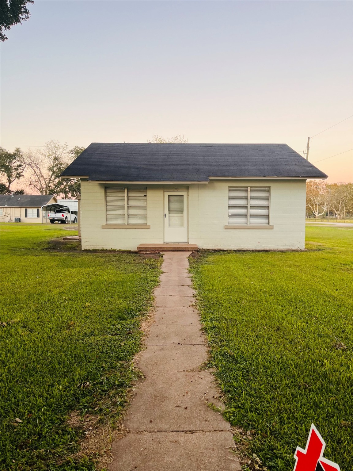 a front view of a house with yard