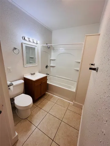 a bathroom with a sink toilet a mirror and shower