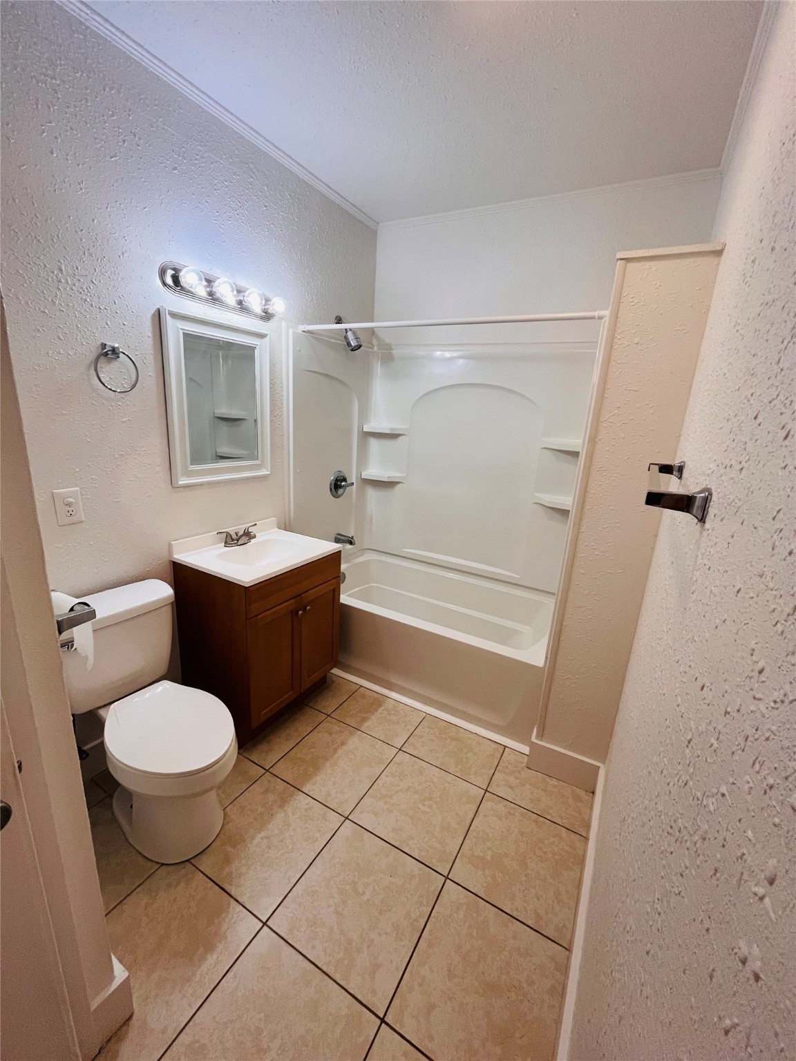 1583 Dover Street, Unit 7 Boling, TX 77420 - Photo 13 of 19 a bathroom with a sink toilet a mirror and shower