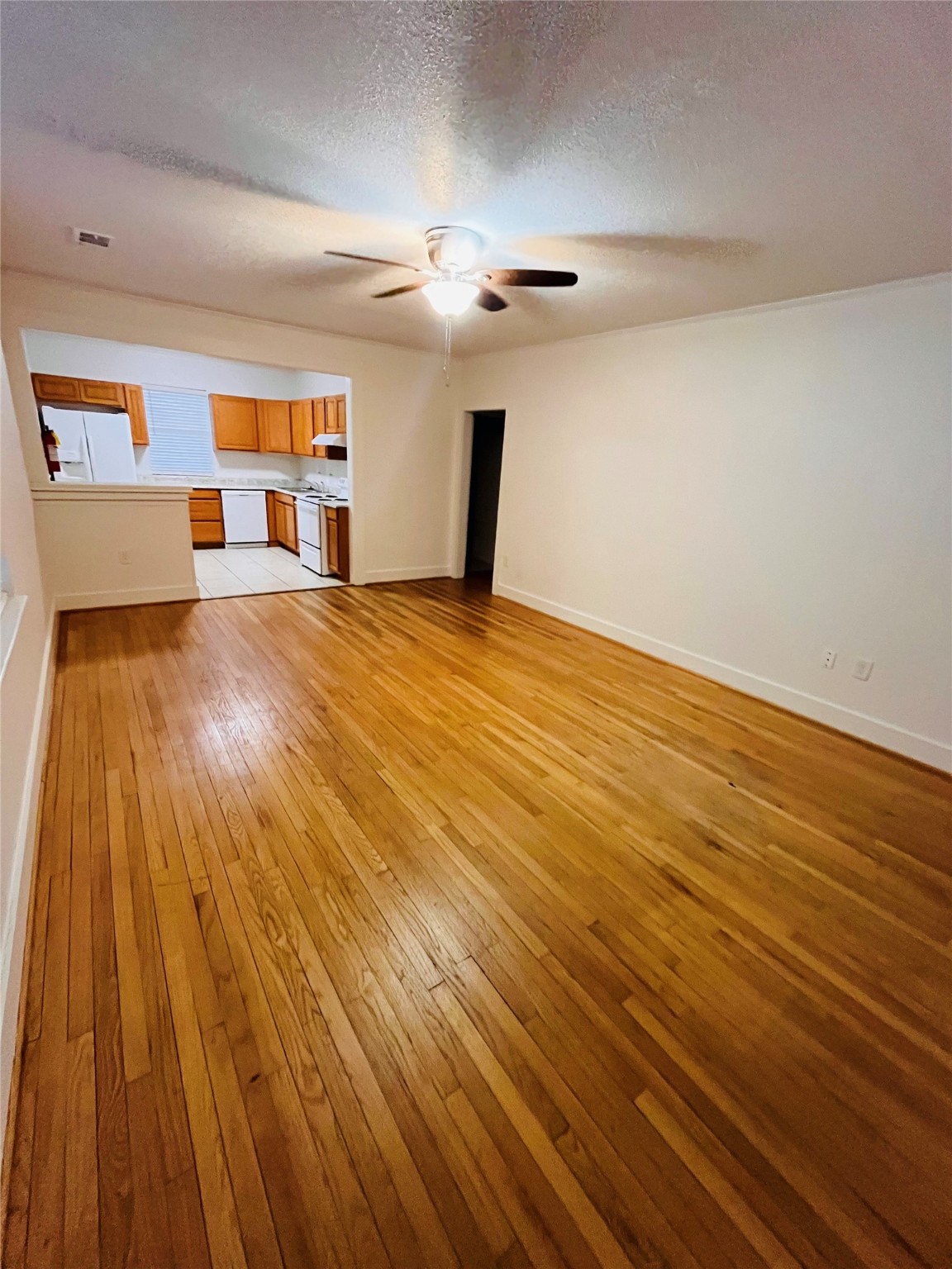 1583 Dover Street, Unit 7 Boling, TX 77420 - Photo 5 of 19 a view of empty room with wooden floor